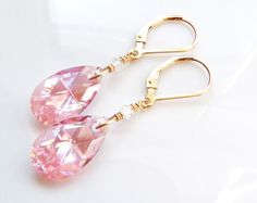 Pink crystal dangle earrings features flattering teardrop shaped Swarovski crystals in a medium pink hue called rose. A sparkly and thoughtful pair dangle earrings for a woman born in October since pink opal is one of her birthstones. Earrings Details: - Choose sterling silver or 14k gold filled - Customize earring closures: leverbacks (shown - clasps on the back), earring wires (like hooks), or dangles off earring posts - Length: 1.50 inches (3.81 cm) long including earring closures shown\ - Sw Pink Teardrop Earrings For Anniversary, Pink Pear-shaped Earrings For Anniversary, Elegant Pink Crystal Drop Earrings, Pink Elegant Teardrop Earrings For Anniversary, Elegant Pink Teardrop Earrings, Elegant Pink Teardrop Earrings For Anniversary, Pink Teardrop Earrings For Wedding, Pink Crystal Drop Earrings For Anniversary, Pink Drop Crystal Earrings For Wedding