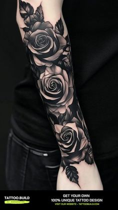 a woman's arm with black roses and leaves tattoo on the left forearm,