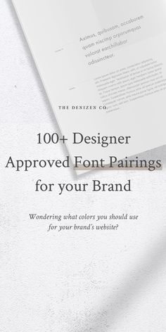 an open book with the title, 100 + designer approved font pairings for your brand