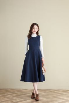 "★★ FEATURES * wool dress * Two side seam pockets * Back zipper closure * Sleeveless dress * Fitted waist dress * A Line Dress * Perfect for Winter, autumn * Dry clean * White blouse is not sale items ★★ The model is 170 cm (5′ 7″) tall with a 80 cm (31.5\") bust, 66 cm (26\") waist. She is wearing the wool dress in size XS. ★★ Please select custom order according to the follow situation Your height is not between 155 cm- 172 cm Your weight is between 47kg and 75 kg Request the length Request a Blue A-line Midi Dress For Winter, Fit And Flare Sleeveless Fall Dress, Fitted Sleeveless Pinafore Dress For Fall, Blue Fitted Sleeveless Pinafore Dress, Fitted A-line Pinafore Dress, Modest Fits Aesthetic, Wool Dress Winter, Pinafore Dress Outfit, Pinafore Outfit