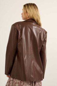 Faux leather blazer jacket. Notch lapel collar. One-button double-breasted closure. Long sleeves. Side flap pockets. Full lining. Oversized fit. 55% Polyester, 45% PU. Imported. Designed in LA. Model wears size S. Leather Blazer Women, Smooth Talker, Faux Leather Blazer, Chestnut Leather, Leather Blazer Jacket, Colour Matching, Pu Fabric, Tailored Blazer, Leather Blazer