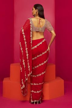 Red pre-draped saree with cutdana, sequin, bead embroidery in floral stripe pattern. Paired with checkered embroidered blouse. - Aza Fashions Designer Draped Saree For Navratri, Navratri Pre-draped Saree With Cutdana, Designer Draped Saree For Diwali, Bollywood Style Designer Red Pre-draped Saree, Bollywood Style Draped Saree With Zari Work, Designer Wear Festive Draped Saree, Designer Festive Draped Saree, Festive Designer Wear Draped Saree, Red Pre-draped Saree With Sheer Dupatta For Eid