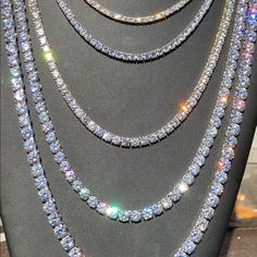 Solid Cubic Zirconium Finished In Rhodium Or Electroplated In 14k Gold! 40-50ct Lab Diamonds...So Icy Perfect Drip For The Summer! 60-80 Grams Depending On Length! Very Heavy And Solid Weight 1 Chain For 150 Don’t Ask Is All The Chains Included For 150 . White Diamond Tennis Necklace Iced Out, White Diamond Iced Out Tennis Necklace, Iced Out White Diamond Tennis Necklace, Diamond White Bling Tennis Necklace, Diamond White Round Tennis Necklace With Bling, White Round Cut Crystal Tennis Necklace, White Crystal Tennis Necklace For Anniversary, White Diamond Tennis Necklace With Bling, White Crystal Tennis Necklace With Diamond Accents