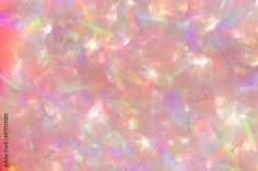 an abstract background with lots of white and pink bubbles in the center, as well as multicolored lights