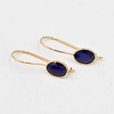 Natural Sapphire Earrings (Pair) ✪Gemstone: Natural Sapphire  ✪Metal: 18k solid Yellow gold. ✪Stone size: 6x8 mm. ✪Stone Shape : Oval  ✪Stone Weight : 2.85 Ct. ✪ Earring Weight : 1.40 Gram ✪Earring Length : 25 mm. ✪Earring width : 7 mm. ✪Setting type: Bezel wire setting. If you need any other preferred stone please contact us. Sapphire benefits - *The result is a good gain of self-confidence and mental balance.         Surprisingly, blue Sapphire also has some health benefits.  *Wearing the Neelam/Blue Sapphire aids in digestion too.  *Having a direct impact on wealth, the Blue Sapphire (Neelam)stone can         cause a boost in finances. QUALITY OF MATERIALS: Metal: Most of our jewelry at JewelryMansion is made with precious metals like gold and silver. These metals are 100% non-allergic Yellow Gold Sapphire Drop Earrings, Gold Sapphire Dangle Earrings, Sapphire Gemstone Earrings, 14k Gold Sapphire Gemstone Earrings, Sapphire Briolette Gemstone Earrings, Sapphire Gemstone Drop Earrings, Gold Sapphire Drop Earrings, Gold Sapphire Earrings Gift, Sapphire Gemstone Earrings As Gift