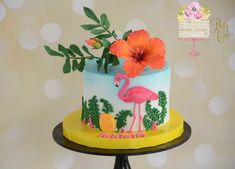 a cake decorated with flowers and a flamingo