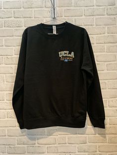 Casual Black Embroidered Sweatshirt, Black Casual Sweatshirt With Embroidered Text, Casual Black Sweatshirt With Embroidered Text, Casual Black Sweater With Embroidered Text, Black Cotton Sweater With Embroidered Text, Black College Sweatshirt With Embroidered Text, Black Sweater With Embroidered Text For Fall, Black Long Sleeve Sweater With Embroidered Text, Black Fall Sweater With Embroidered Text