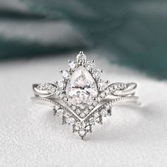 1.50 CT Pear Cut Cluster Twisted Moissanite Bridal Ring Set - crownmoissanite Pear Moissanite Engagement Ring, Diamond Bridal Ring Sets, Detailed Engagement Ring, Types Of Diamonds, Moissanite Earrings, Moissanite Wedding Bands, Bridal Ring Set, Bridal Ring, Engagement Ring Wedding Band