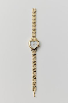 Linked chain watch watch topped with a heart-shaped case we love. Content + Care Mixed metal, glass Wipe clean Imported Size Dimensions: 7.5" l | Heart Linked Watch in Gold, Women's at Urban Outfitters Gold Watch Aesthetic, Christmas List Ideas For Women, Urban Outfitters Aesthetic, Heart Shaped Watch, L Heart, Jewelry 2024, Chain Watch, Heart Watch, Pinterest Contest