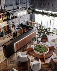 an aerial view of a restaurant with tables and chairs in the center, surrounded by large windows