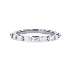 a white gold wedding band with baguetts set in the middle and diamonds on each side