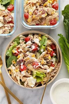 two bowls filled with salad next to some lettuce