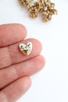 Artisan porcelain heart charm pendant for your creations (jewellery making, scrapbooking, journal...) Handmade and fired in my studio in the Burgundy region of France. Hand painted and kiln fired real gold decor. White porcelain with a transparent glaze on the top (unglazed on the back). Gold filled jump ring 6mm Hand Painted White Heart Jewelry, White Hand Painted Heart Jewelry, Porcelain Heart, Scrapbooking Journal, Heart Rings, Journal Handmade, Handmade Journals, Gold Decor, Pendant Gold