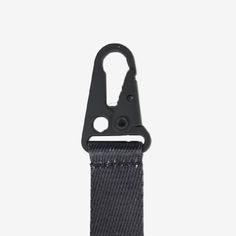 a black strap with a metal hook on it