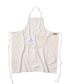 an apron that is white and has a tag on it