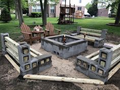 an outdoor fire pit made out of cinder blocks