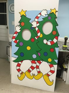 a cardboard cutout of two christmas trees