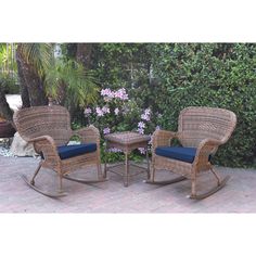 two wicker rocking chairs with blue cushions