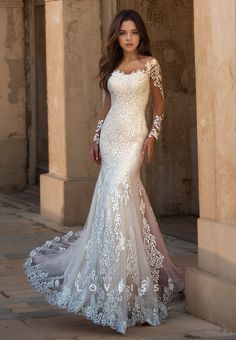 a woman in a wedding dress posing for the camera