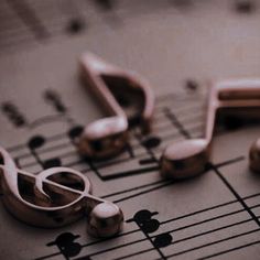 music notes and musical instruments are arranged on top of each other in this close up photo