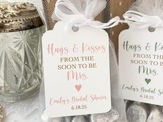 wedding favors are wrapped in white paper and tied with twine ribbons, sitting on a table