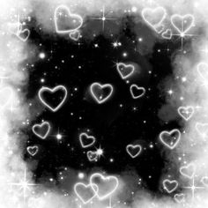 black and white photo with many hearts in the sky, stars and clouds around it