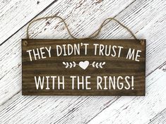 a wooden sign that says they didn't trust me with the rings