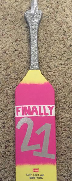 a pink and yellow tag with the number twenty one on it that says finally 21