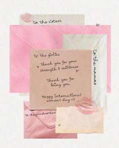 a piece of paper that has some writing on it with pink and white papers around it