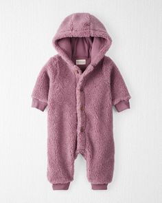 Made to layer in a looser-fit, this 1-piece sherpa jumpsuit features details like faux wood buttons that are safer for baby and an attached hood. With an extra-soft jersey lining for warmth and comfort, you'll want to come back to this jumpsuit over and over again. Crafted in the purest organic fabrics and sustainable materials, Little Planet is a return to simplicity. Thoughtful essentials and timeless pieces to gift or to hold on to. Winter Onesie For Playtime, Winter Playtime Solid Onesie, Winter Playtime Solid Color Onesie, Cozy Solid Onesie For Winter, Cozy Solid Color Onesie For Winter, Cute Raincoats, Apple Watch Bands Fashion, Organic Kids Clothes, Wood Buttons