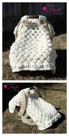 crocheted white purse sitting on top of the grass in front of a fence