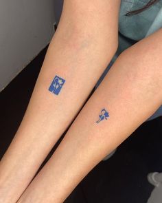 two people with matching tattoos on their legs