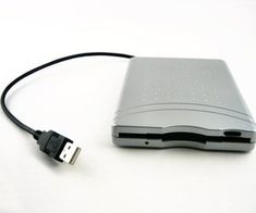 an external hard drive attached to a laptop computer with a usb cable plugged into it