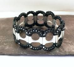 a black and white bracelet with circles on it