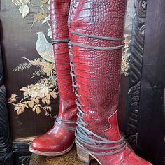 Freebird Coal Knee-High Red Boot With Laces - Size 6 Brand New In The Box - In Excellent Condition. These Knee-High Boots Are Great For Casual Wear, Travel, Riding, Biker, Brunch Or Wine With Friends. The Leather Upper Is A Rich Deep Red With Embossed Crocodile Pattern. The Back Has A Distressed Brown Inset Laced With Brown Leather, Giving It An Interesting Design. The Boots Have A Long Side Zipper. The Heel Is 2- 2.8 " Tall. Original Price - $395.00 The Shoe Runs True To Size. Please Read & Loo Wine With Friends, Freebird Shoes, Leather Lacing, Gorgeous Boots, Interesting Design, Tall Boot, Crocodile Pattern, Red Boots, Lace Inset