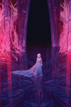 the frozen queen is standing in front of an ice cave with red lights on it