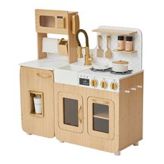 a wooden toy kitchen with white and beige appliances