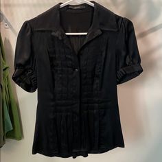 Tahari Black Silk Top. Size Small. Stunning Detail On Front. Fully Button Down Short Sleeve. Nwot, Never Worn. Smoke Free, Pet Friendly Home. Fitted Black Blouse For Office Wear, Short Sleeve Blouse With Buttons For Night Out, Fitted Black Blouse With Buttons, Black Short Sleeve Blouse For Formal Occasions, Black Office Blouse With Buttons, Formal Black Short Sleeve Blouse, Black Short Sleeve Formal Blouse, Formal Black Blouse With Button Closure, Black Button-up Top For Evening