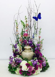 a vase filled with lots of different flowers