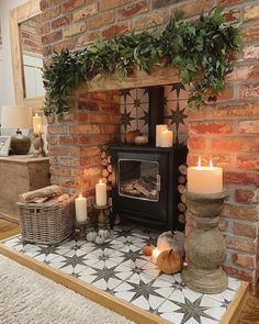 Farmhouse brick style fireplace Living Room Logburner, Christmas Log Burner Fireplace, Log Burner Christmas Decorations, Birch Logs In Fireplace, Decorative Logs In Fireplace, Tv On Wall Next To Fireplace, Fireplace Logs Decorative, Cozy Cottage Style Living Room, Brick Hearth Ideas