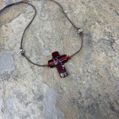 This beautiful Murano glass cross pendant hangs on natural cotton cord along with sterling silver accent beads. Finished with a sterling silver S hook clasp. 18 inches Cross pendant: 1 x .75 inch To see more from East Village Jewelry~ http://eastvillagejewelry.etsy.com All orders ship out within 24 hours, excluding holidays and Sundays Feel free to contact me with any questions. Use coupon code VILLAGE14 for 10% off all orders over $200.00 THIS ITEM WILL SHIP OUT WITHIN 24 HOURS OF ORDERING FREE Star Cross, Labradorite Bracelet, Bride And Groom Gifts, Hook Clasp, Strand Bracelet, Cross Pendant Necklace, Silver Accents, Multi Strand, Natural Pearls