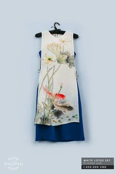 white lotus and koi design on layered panel dress. Koi Design, Vietnamese Traditional Dress, Vietnamese Dress, White Lotus, Batik Dress, Panel Dress, 자수 디자인, Trending Fashion Outfits, Most Wanted