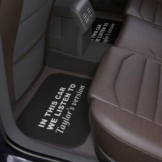 the interior of a car with leather seats and floor mats that read, we can't stop here