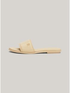 Tommy Hilfiger women's sandal. These chic slides have a considered minimalist look thanks to the tonal design finished with a subtle embossed TH monogram.  Material: 100% Leather (fwa). Tommy Hilfiger Shoes Women, Th Logo, Tommy Hilfiger Store, Hilfiger Shoes, Tommy Hilfiger Shoes, Kids Sale, Women Sandals, Leather Slides, Tommy Hilfiger Women