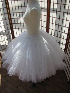 This listing is for a custom order for me to make a duplicate of the double layer white petticoat shown in the photos, except it will be made to fit your waist and desired length. It will be made of soft nylon organdy with polyester bridal satin waist. The pictured petticoat was designed for a 29 inch (73,5cm) waist and is 25 inches (63,5cm) long. Please feel free to ask me any questions :) WAIST: Please select your waist from the listed ranges in inches or centimeters. LENGTH: Please let me kno White Petticoat For Costume, White Tulle Petticoat With Attached Cancan, White Ruffled Petticoat For Wedding, White Crinoline Petticoat With Attached Cancan, Elegant White Crinoline Petticoat, Elegant White Petticoat For Costume, Dream Daughter, Junk Kouture, White Petticoat