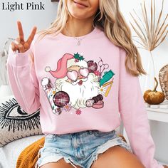 Barber Sweatshirt For Women Retro Pink Santa Sweater Girl Barber Sweatshirt Cute Barber Sweater Barber Christmas Gift Barber Xmas Sweatshirt Crewneck Pink Christmas >>ADDITIONAL DETAILS<< *Solid colors are made 50% cotton 50% polyester. Heather  colors - 60% polyester, 40% cotton. *Unisex Sizing- Runs True to Size *Relaxed Fit *The collar is ribbed knit, so it retains its shape even after washing.  *Designed & professionally printed in the USA *Products are DTG Printed (Direct To Garment) The ink is infused to fabric for long lasting wear. No vinyl is used. ***Custom Orders Are Available: Just send me a message.  *Production Times: Take 1-3 Business Days. *Shipping Times: Take 3-7 business days (usually only takes 2-4 business days) *Holiday times may take longer *Garment Care: Turn garmen Tech Christmas Gifts, Christmas Gift Nails, Santa Sweater, Christmas Gifts For Nurses, Pink Santa, Party Sweaters, Santa Sweatshirt, Nurse Christmas, Nurse Sweatshirt