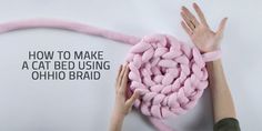 two hands are holding pink yarn in the shape of a cat's head and text reads how to make a cat bed using ohho braid