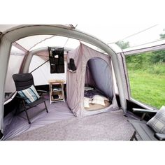 the inside of a tent with two chairs