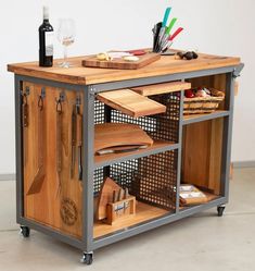 a kitchen island made out of metal and wood