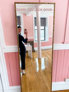 a woman taking a selfie in front of a mirror with the words damn, you look good on it